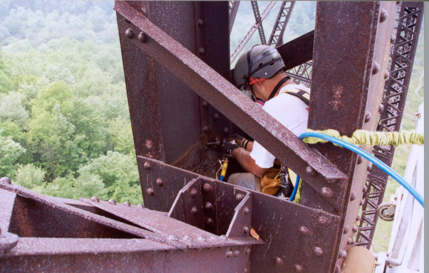 Man inspecting a bridge