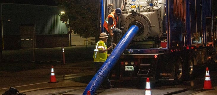 Pipeline rehabilitation crews working at night