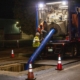 Pipeline rehabilitation crews working at night