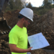 Ethan Williams observes construction of a sewer system