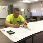 Ethan Williams reviews construction plans