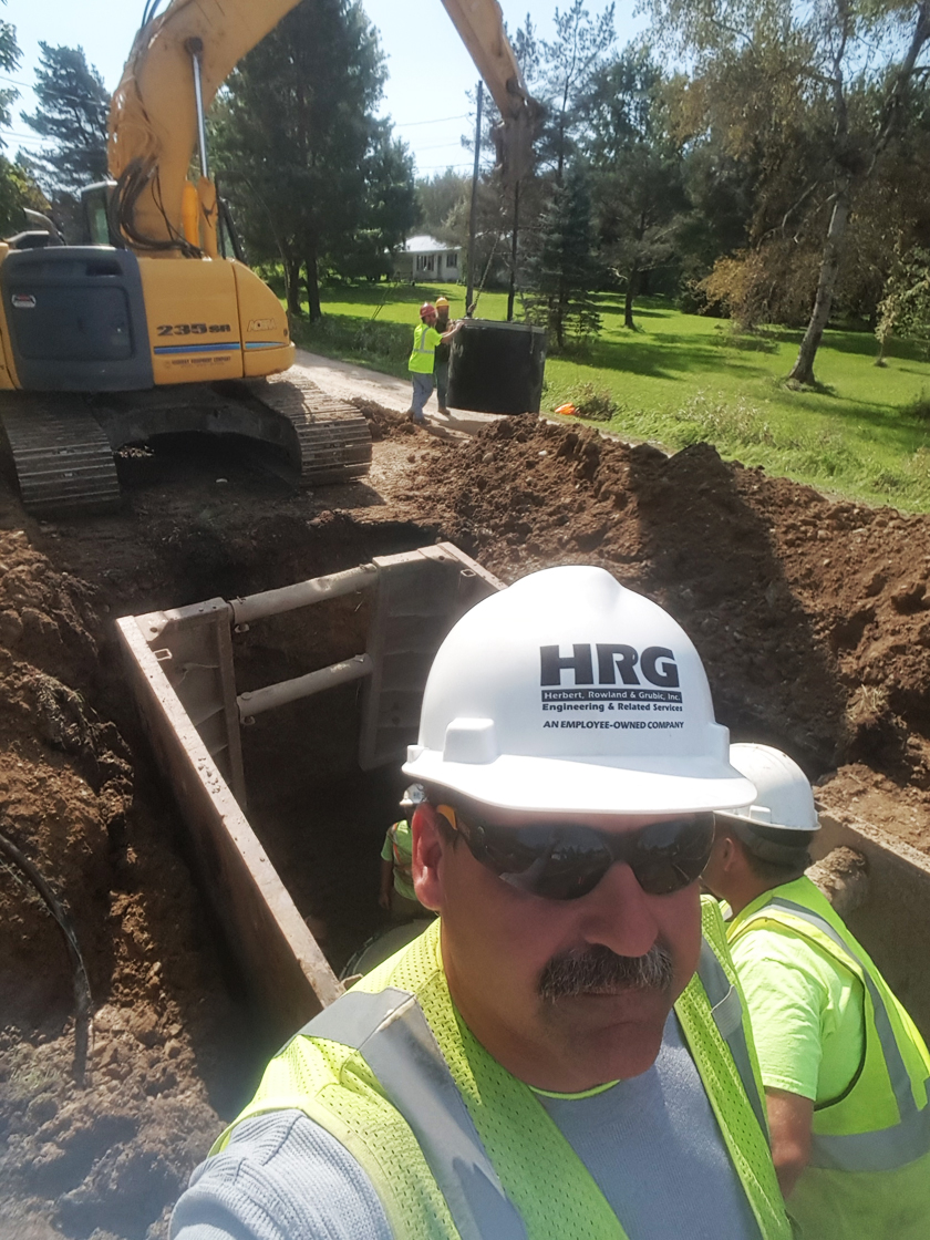 Ryan Sekerski observes construction of water and sewer systems