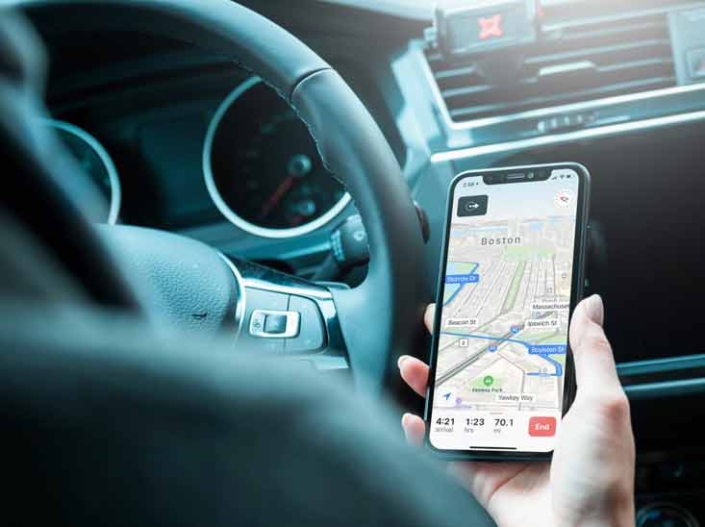 driver looking at navigational app on phone