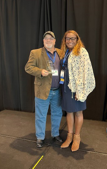 James Tomaine accepts an award for Integrated Water Resources Management at the American Water Resources Association national conference, November 2022