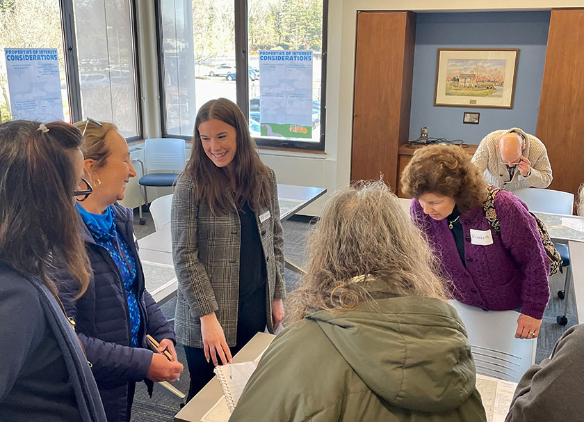 HRG planner Kaitlin Mills leads a public meeting where citizens mark desired destinations and pedestrian barriers on a map